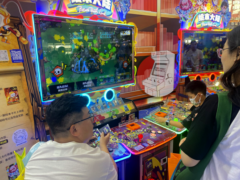 Picture Book Land cabinet image with people playing it at AAA 2024