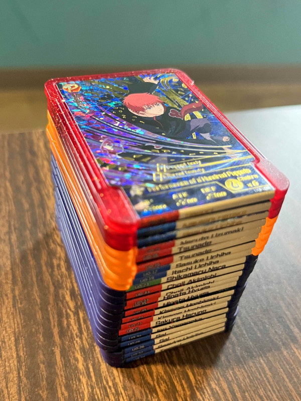 A stack of cards or "plates" of Shinobi Plates used in the Naruto Emblem Battle by Marvelous