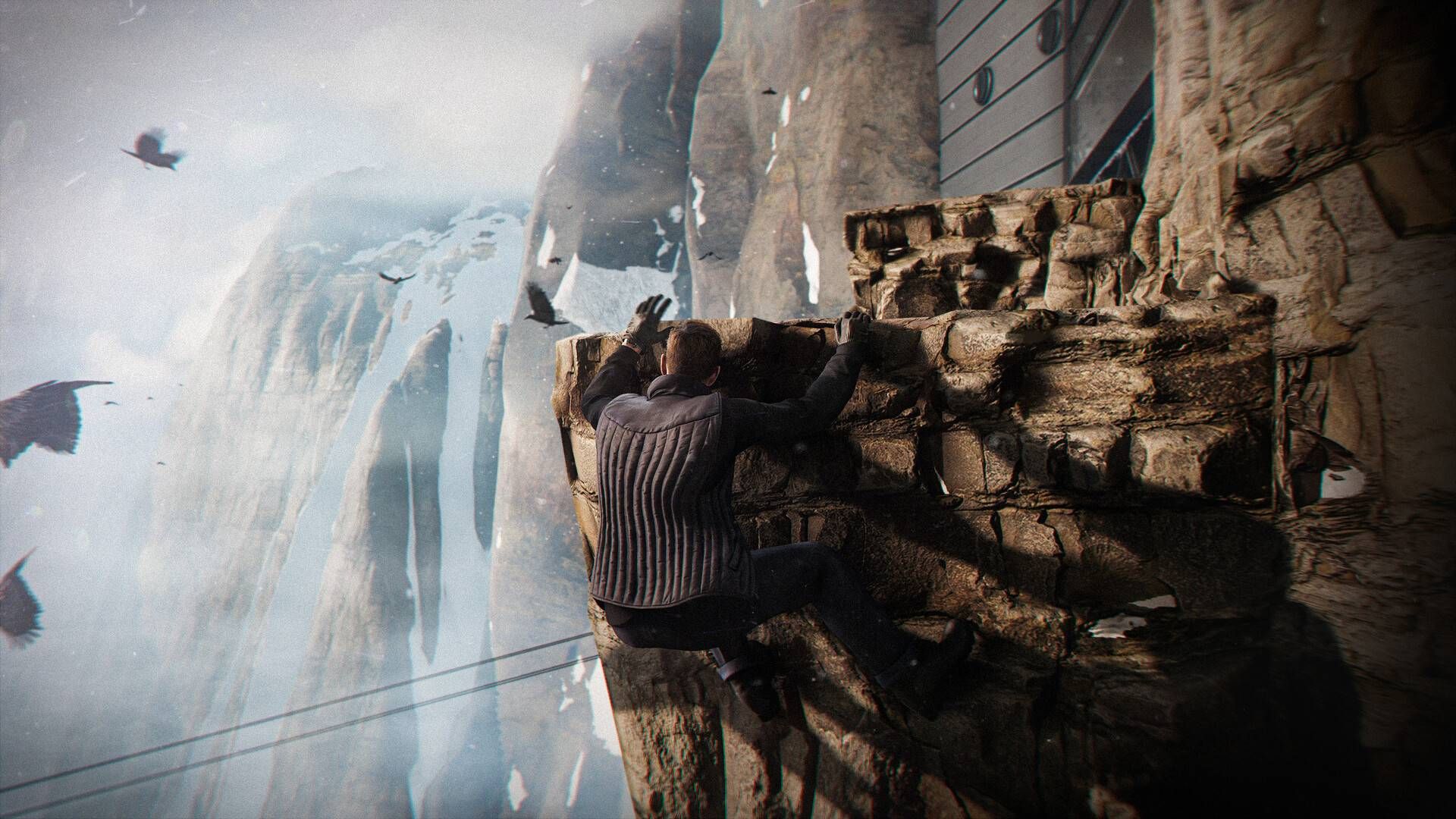 Bond hanging from a rocky ledge in Antarctica in 007 First Light.