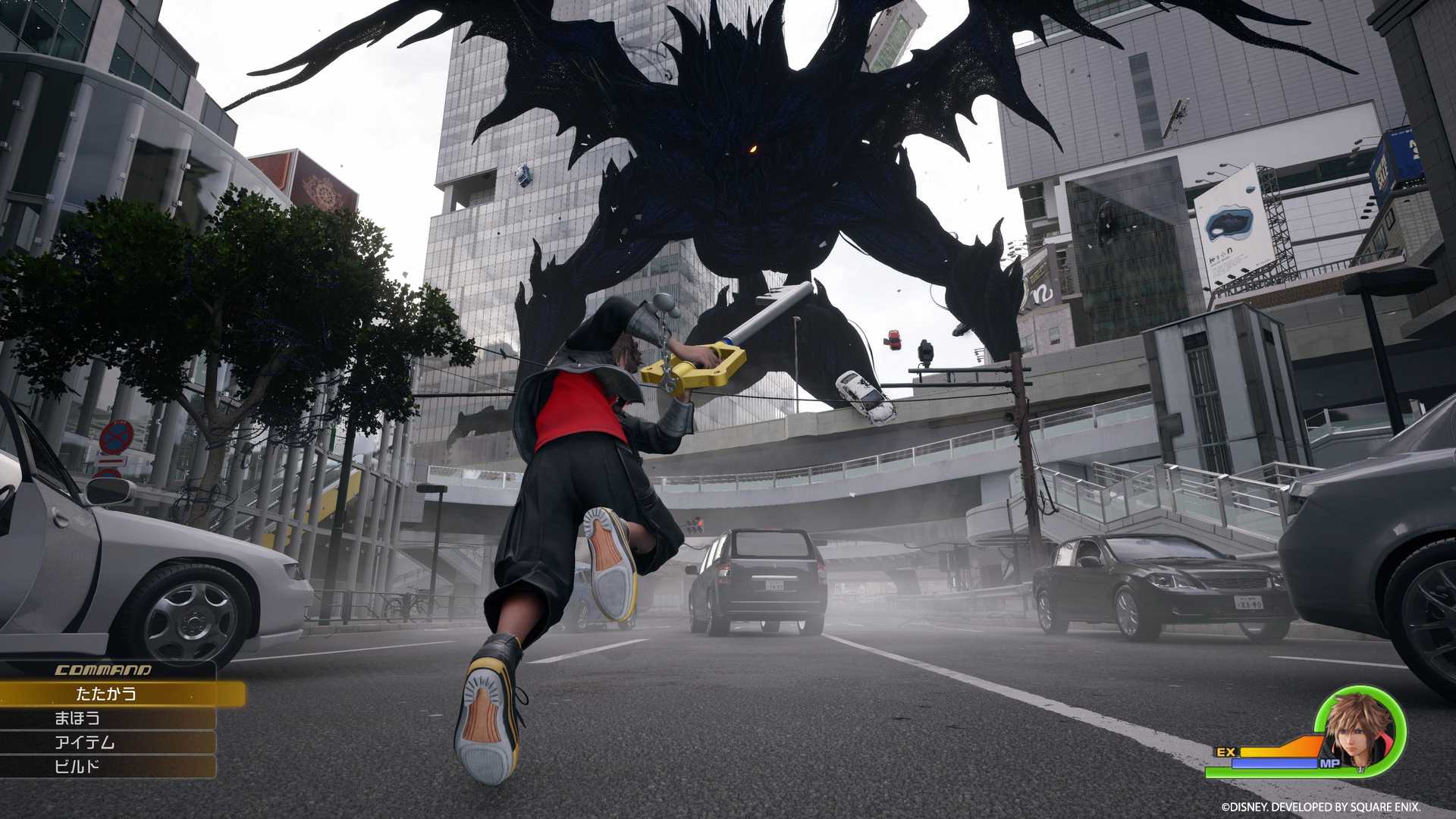 Sora battles a giant Heartless on the streets of Shibuya (aka Quadratum) in Kingdom Hearts 4