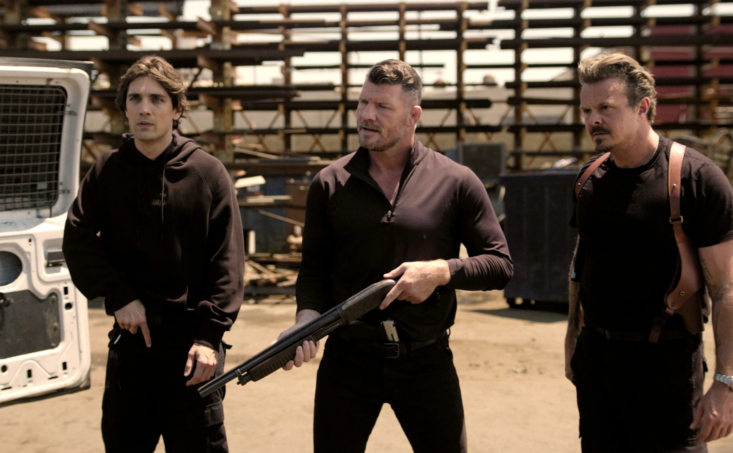Three guys with guns wearing black in Atlas King