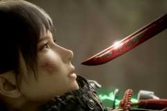 Emma looks at a bloody sword in Beast of Reincarnation.