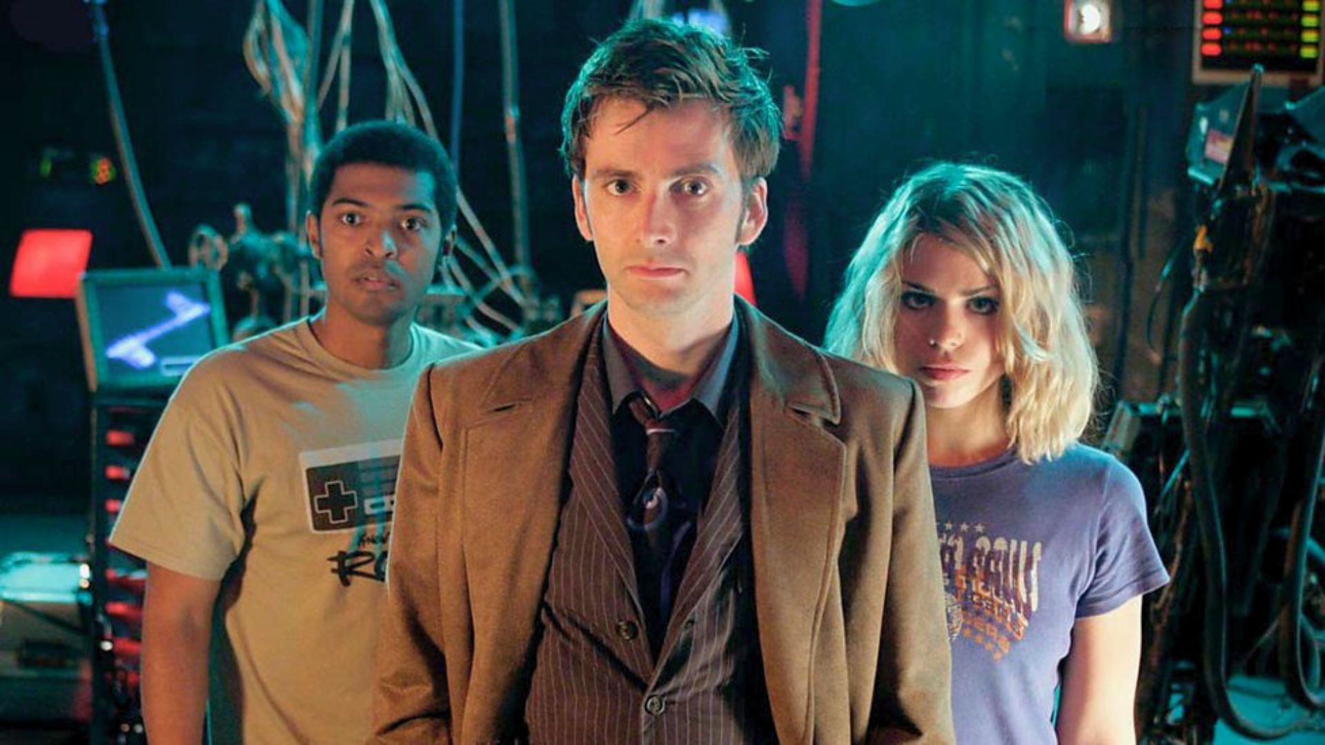An image of the Doctor, Mickey and Rose. The Doctor stands in the middle.