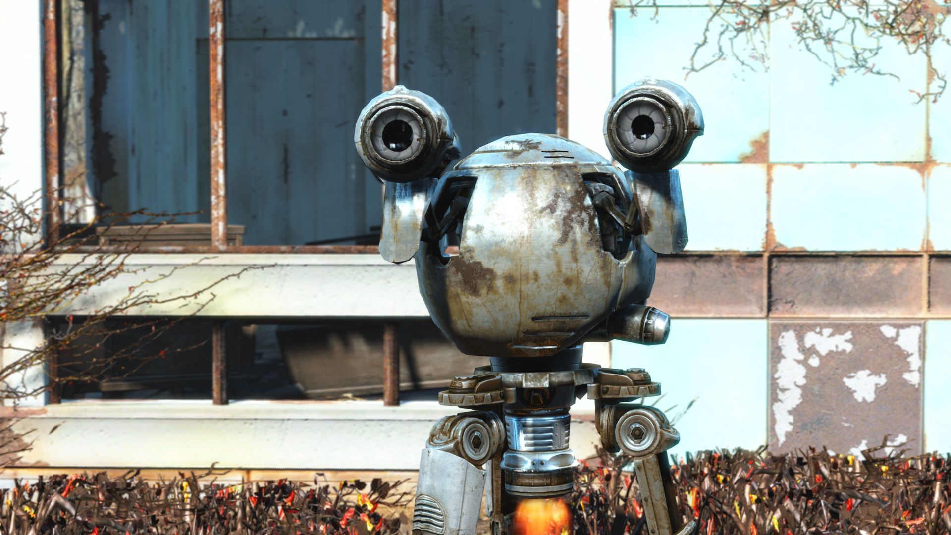 A closeup of Codsworth, floating in front of a ruined house in Sanctuary