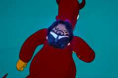 homer simpson runs around with john wick sprite on his back