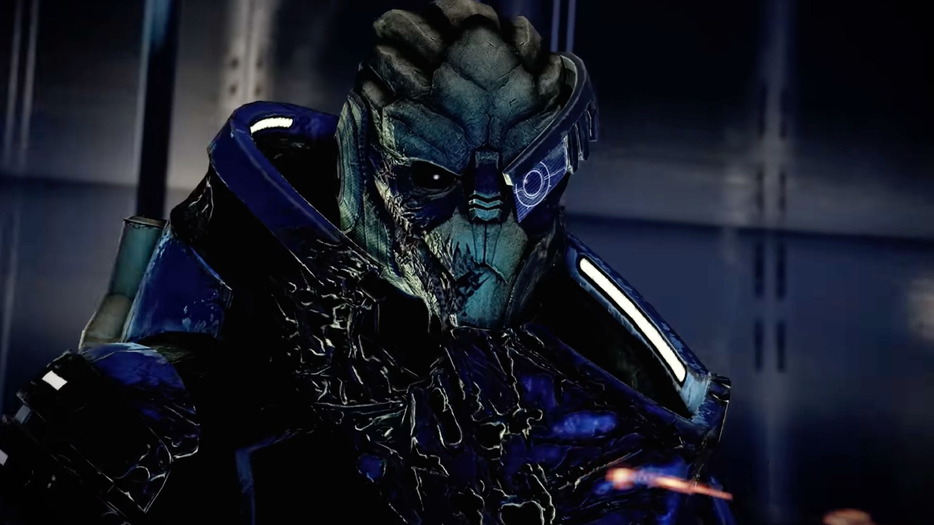 A close-up of Garrus, an alien from Mass Effect, wearing blue armor and a visor over one eye.