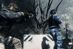 A soldier sneaks up on an enemy in Ghost Recon: Future Soldier