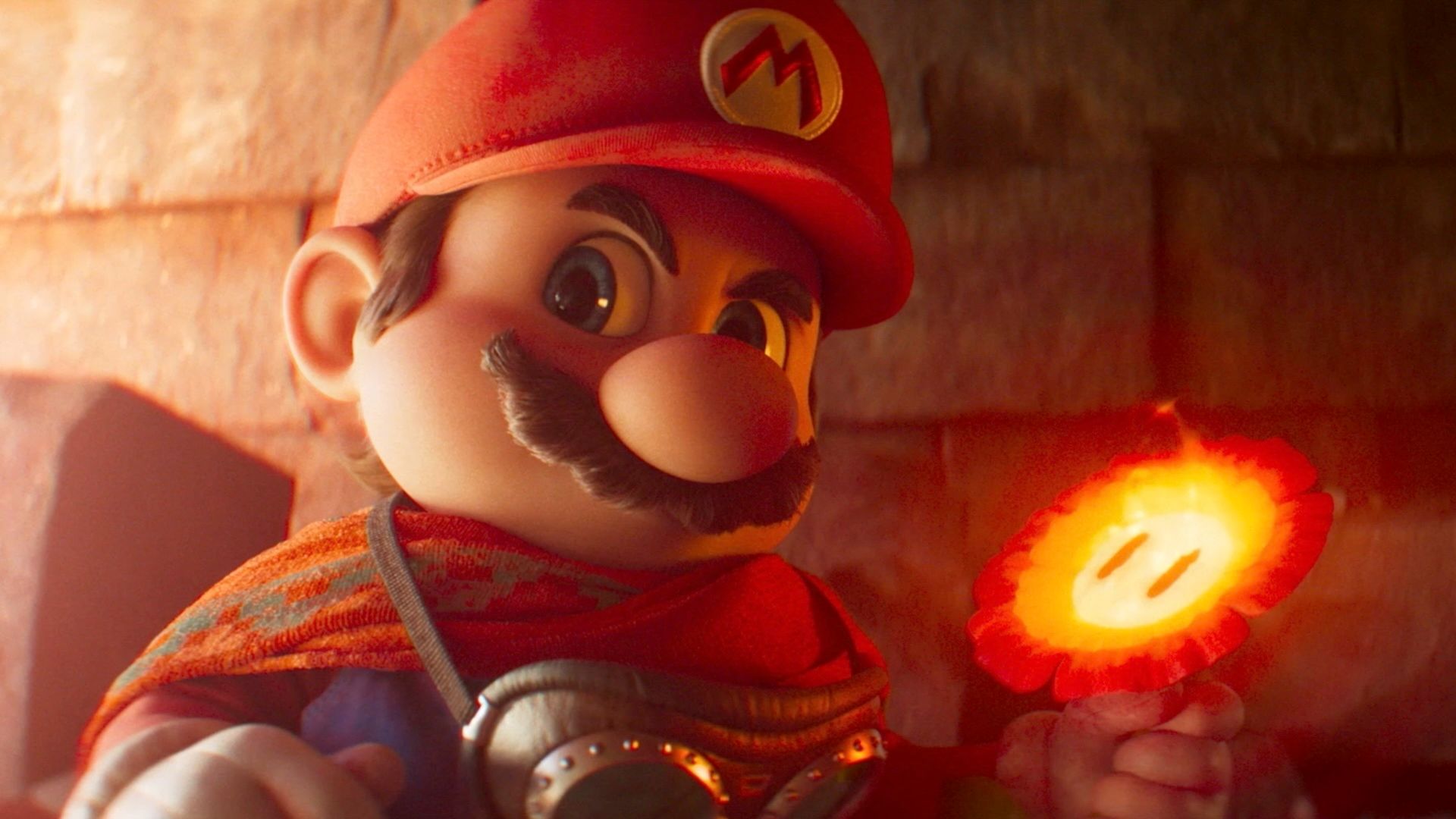 Mario holds a Fire Flower in his left hand in a still from The Super Mario Galaxy Movie