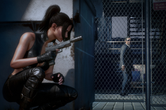 Julia Black hides behind a fence in MindsEye.