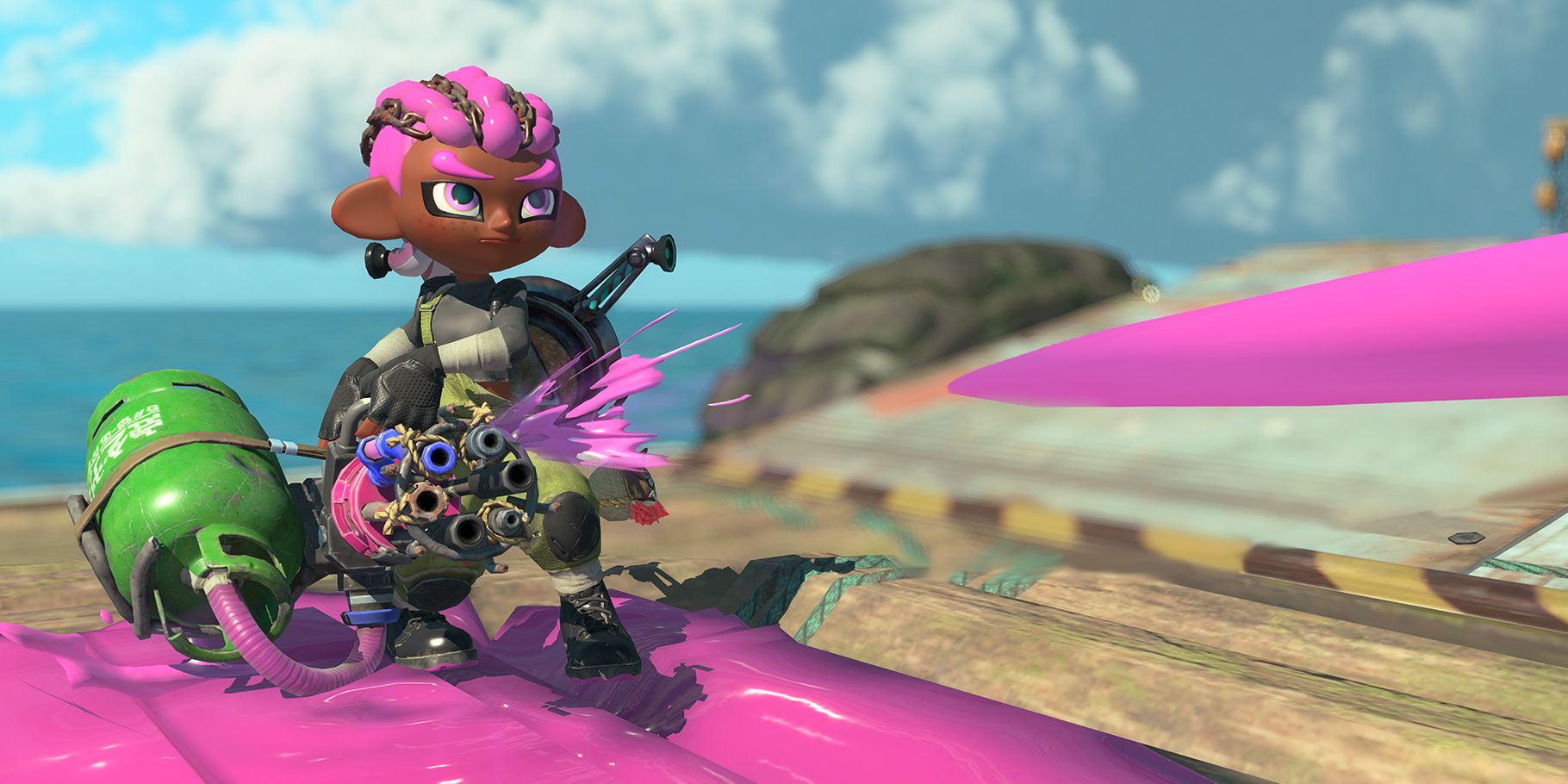 An Inkling with braids shoots a paint minigun