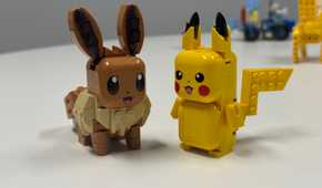 Eevee and Pikachu Smart Play toys sit next to each other.