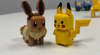 Eevee and Pikachu Smart Play toys sit next to each other.