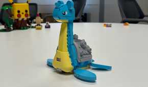 A Lego Lapras sits on a table.