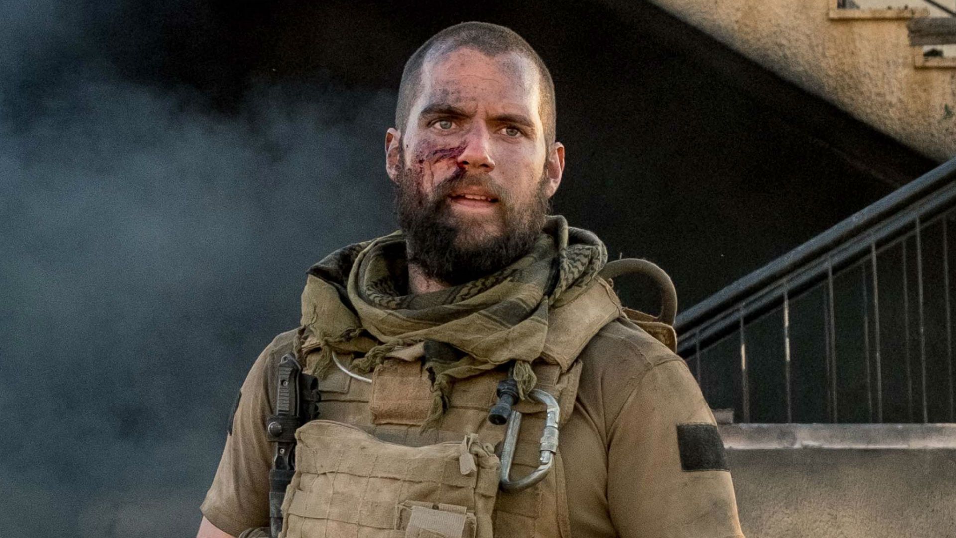 Henry Cavill with shaved head and beard in Sand Castle