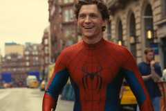 Spider-Man in his suit without his mask, smiling.