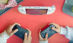 A still of two players using Steam Controllers to play on a handheld PC