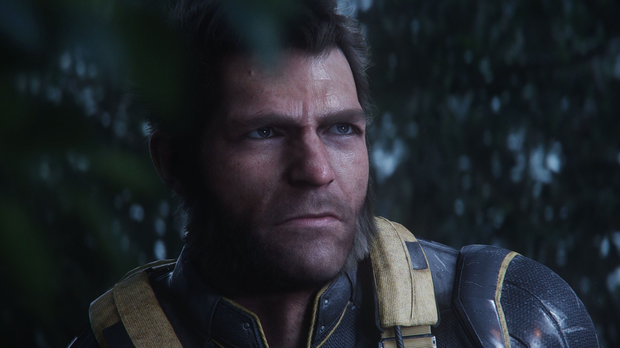 Wolverine with no mask on looks thoughtfully into the distance