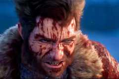 Logan covered in blood in Insomniac Games' upcoming Marvel's Wolverine, a PS5 exclusive. Logan is wearing a fur coat.