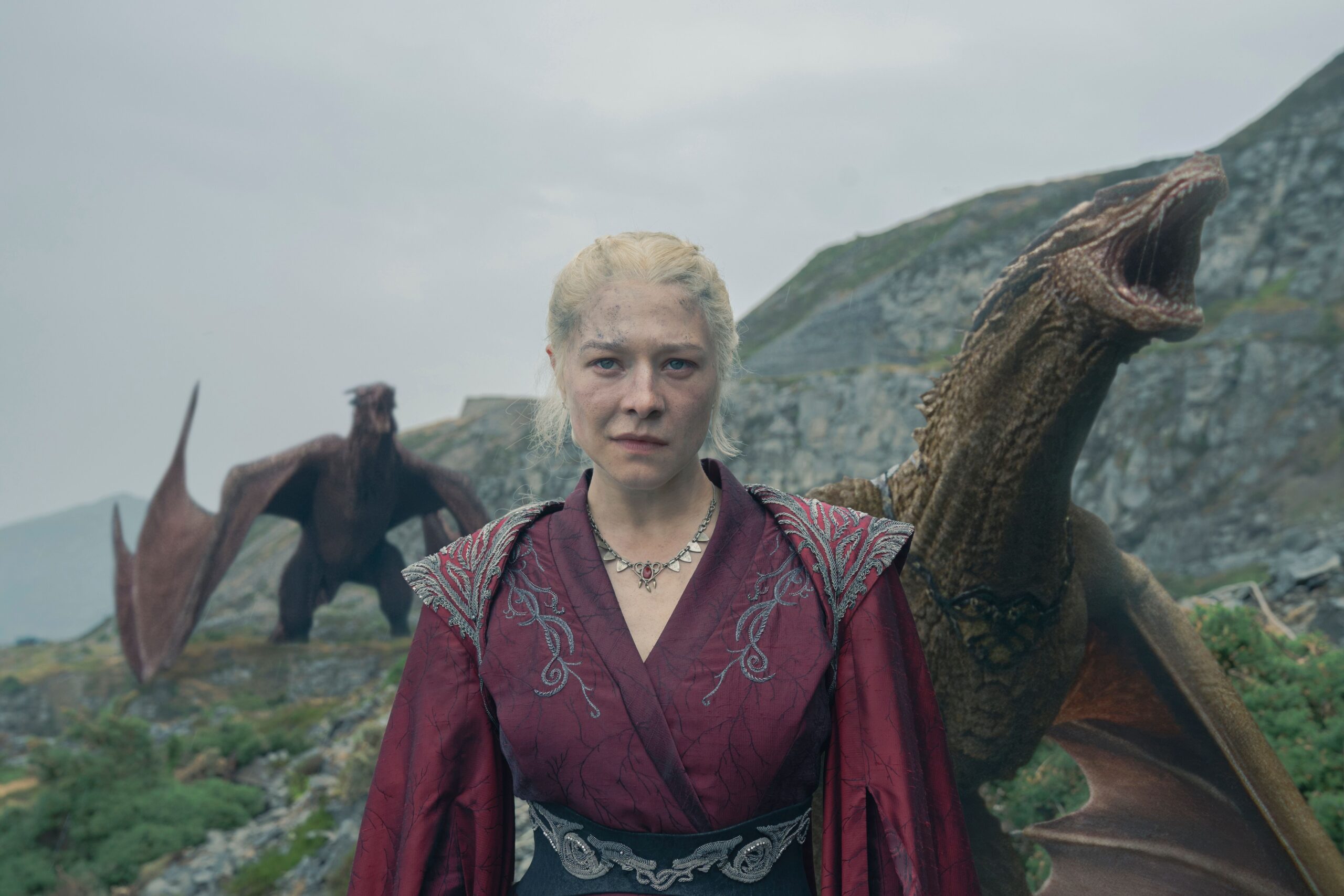 Rhaenyra (Emma D’Arcy) standing on Dragonstone with dragons behind her in a still from House of the Dragon season 2 episode 7