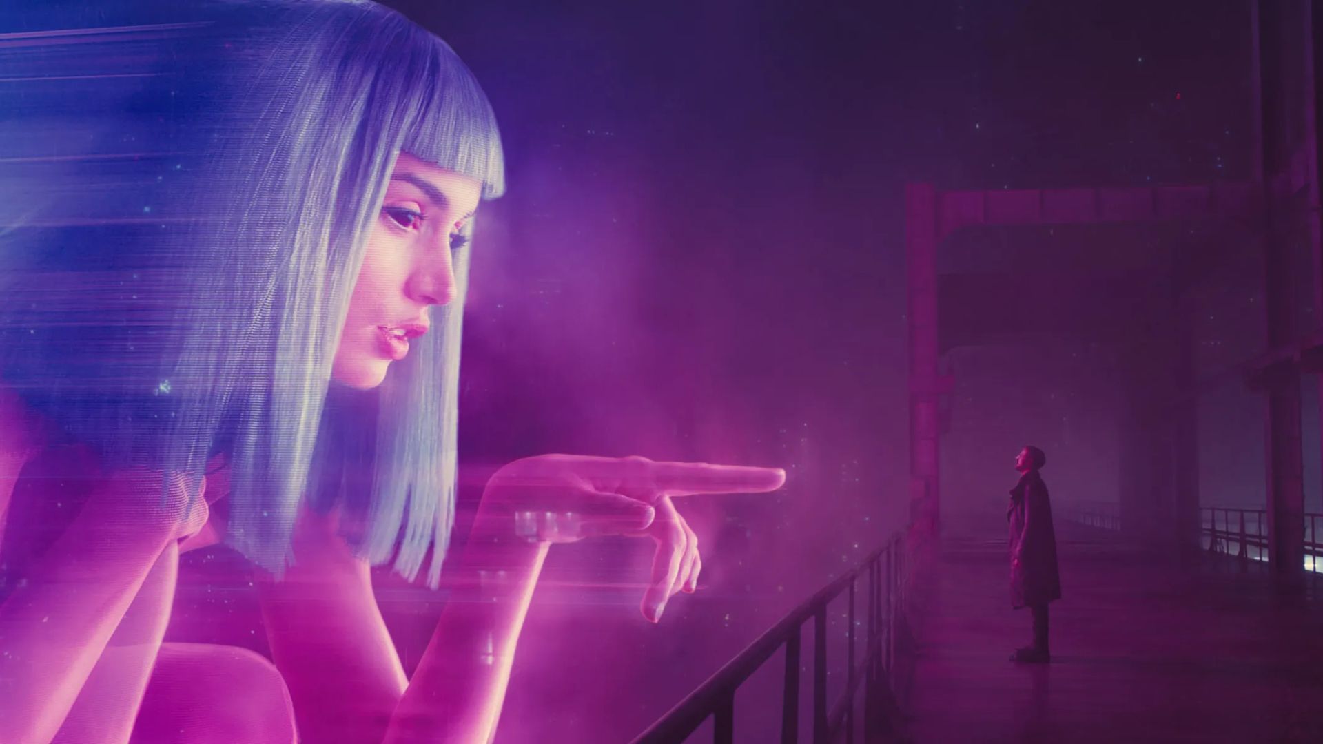Still from Blade Runner 2049 featuring K and a blown up hologram of the fictional Joi AI. 