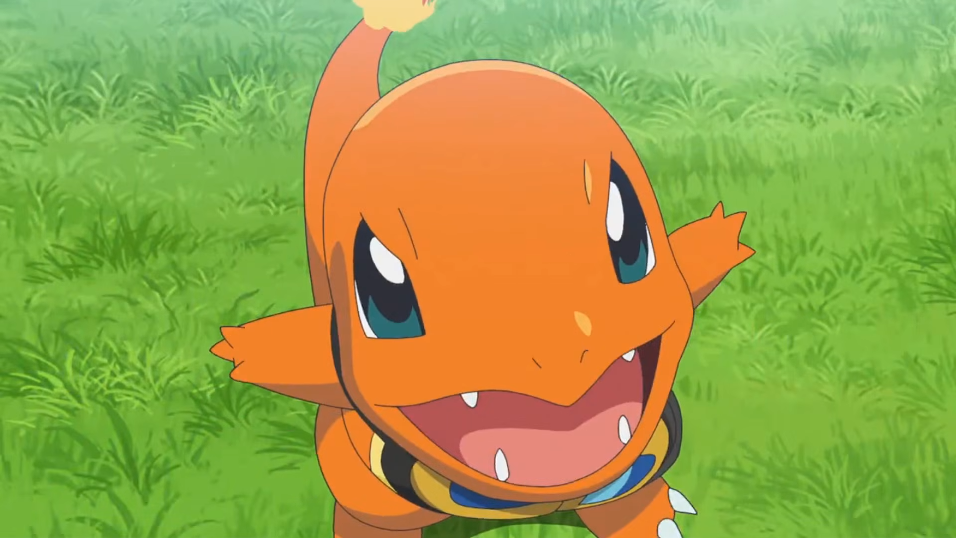A Charmander with goggles trying to be intimidating but being cute instead.