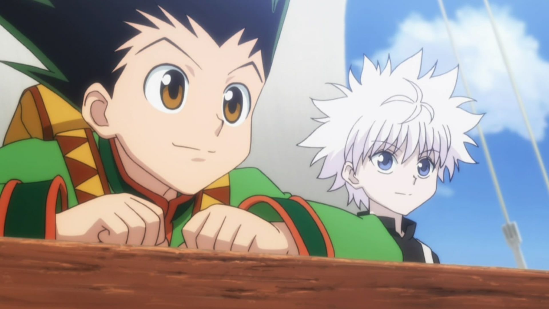 Gon and Killua looking out at the sea from the port of a ship.