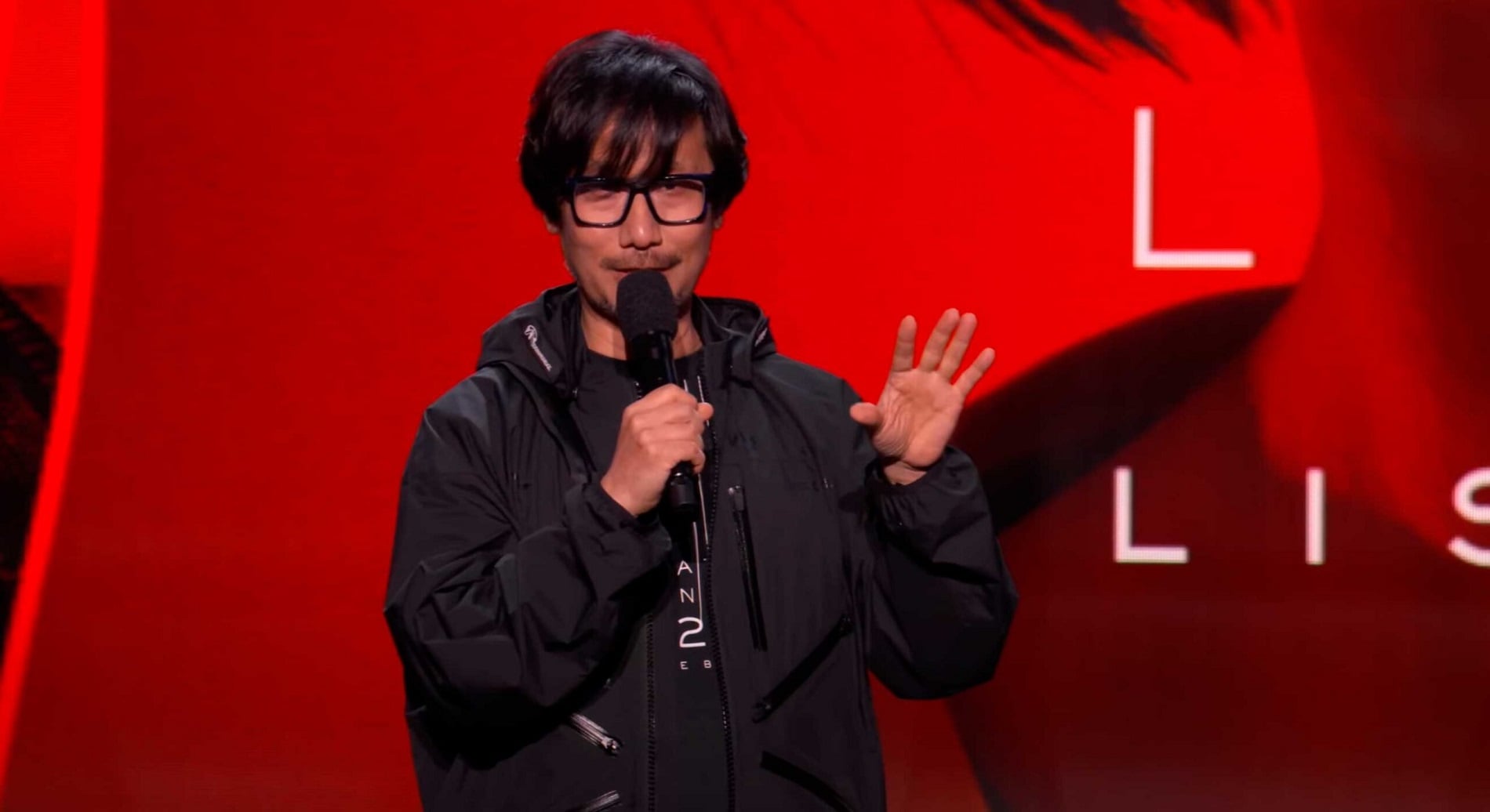 Hideo Kojima talks about his games on stage.