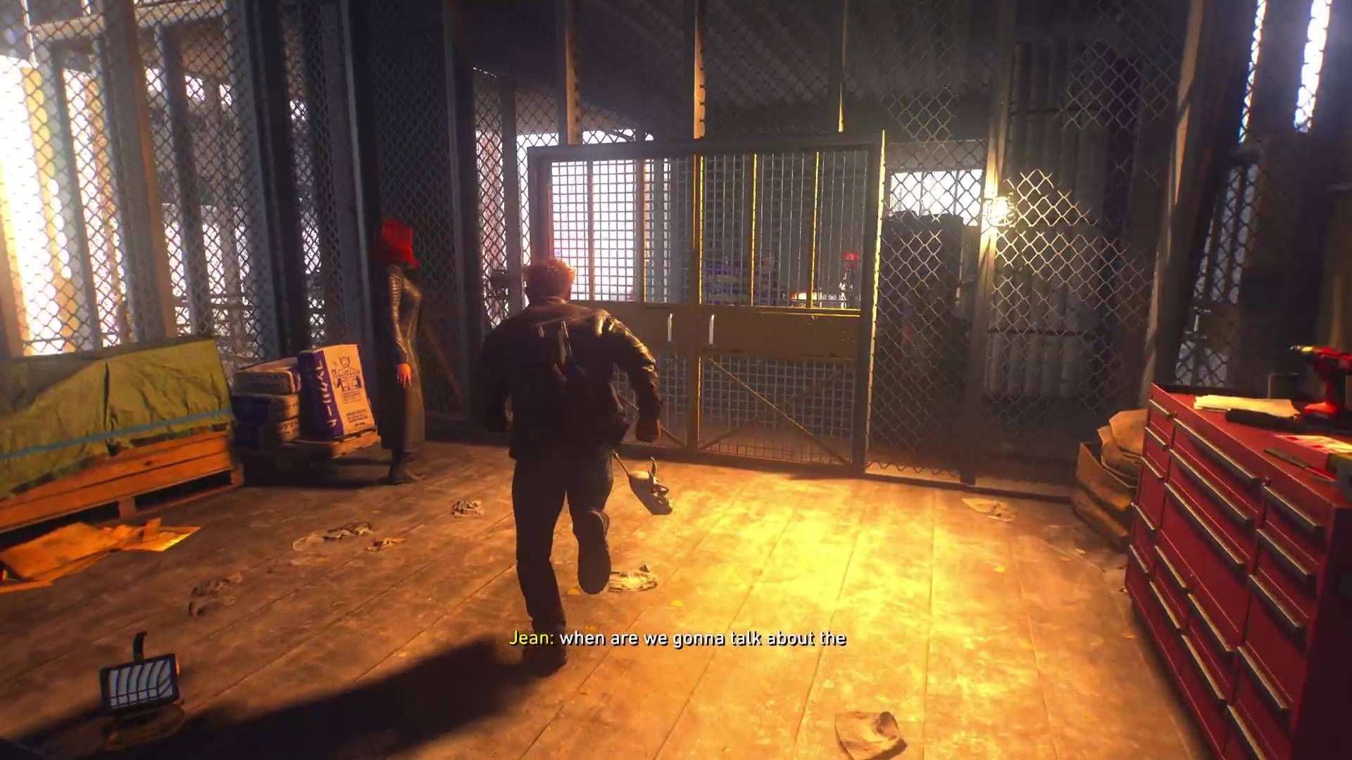 Logan approaching a yellow gate in Marvel's Wolverine.