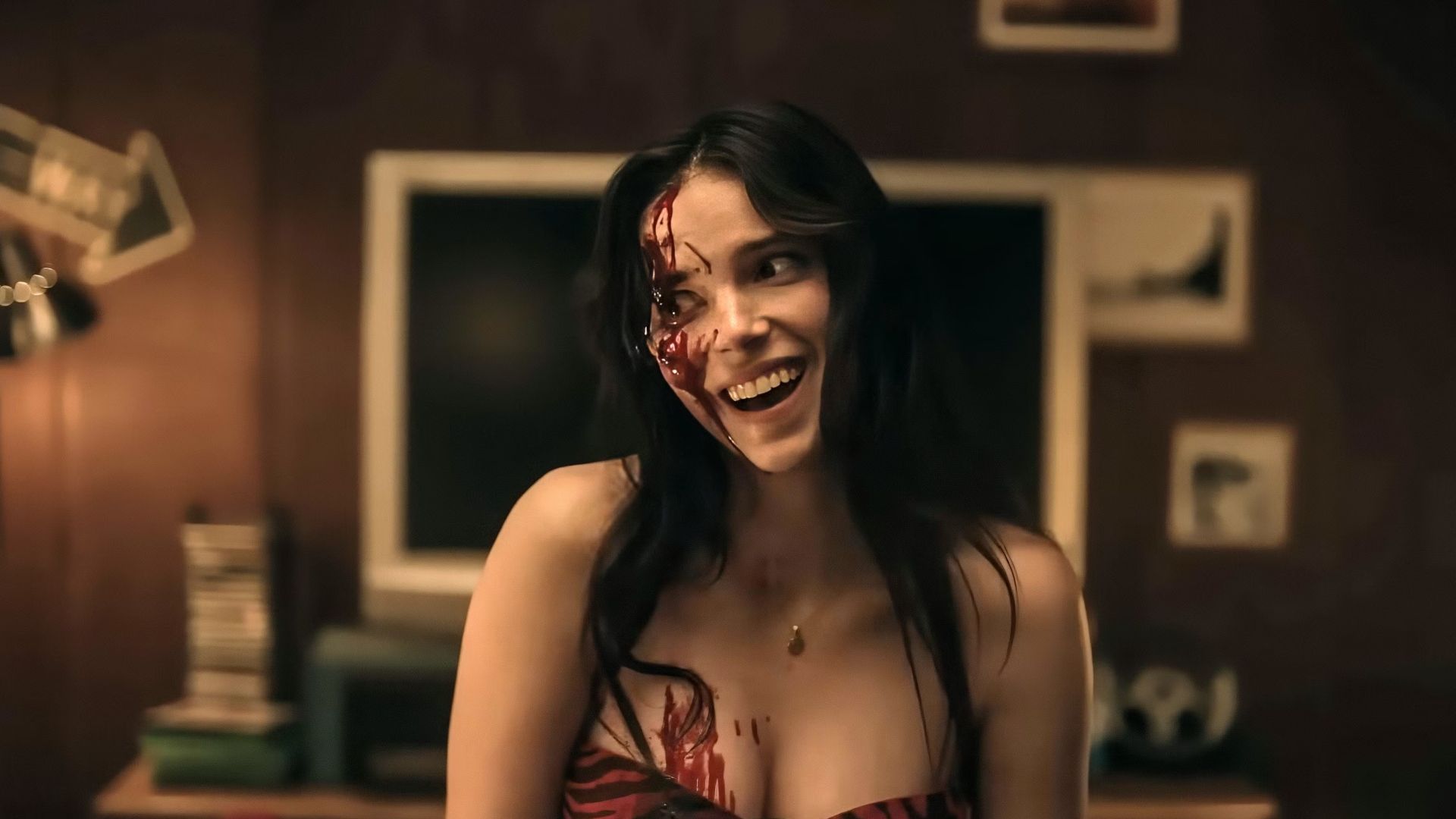 Nikki giving an unnerving smile while covered in blood