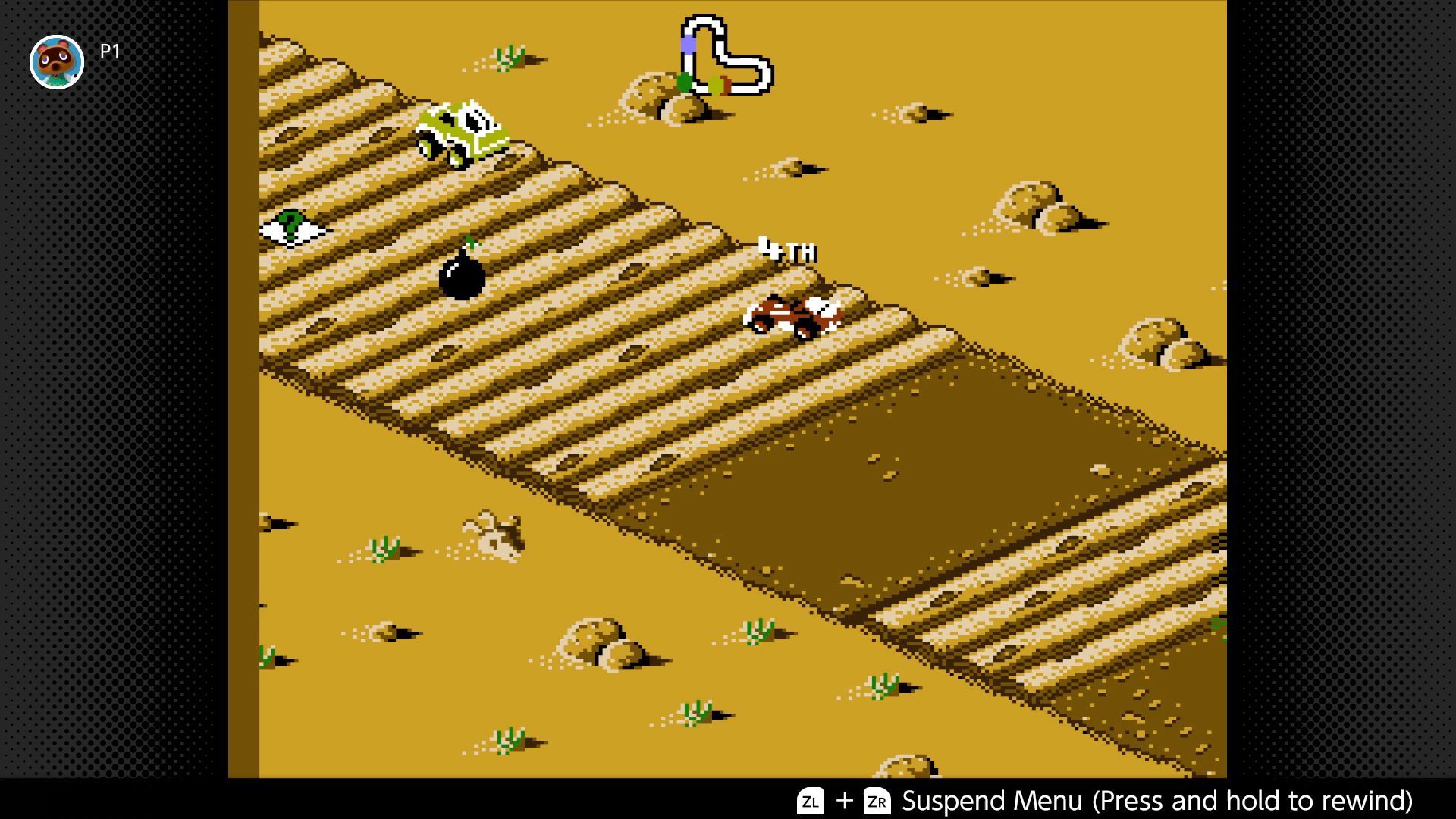 RC Pro-Am 2 screenshot - Trailing in fourth place, the red buggy proceeds across rough terrain in the desert