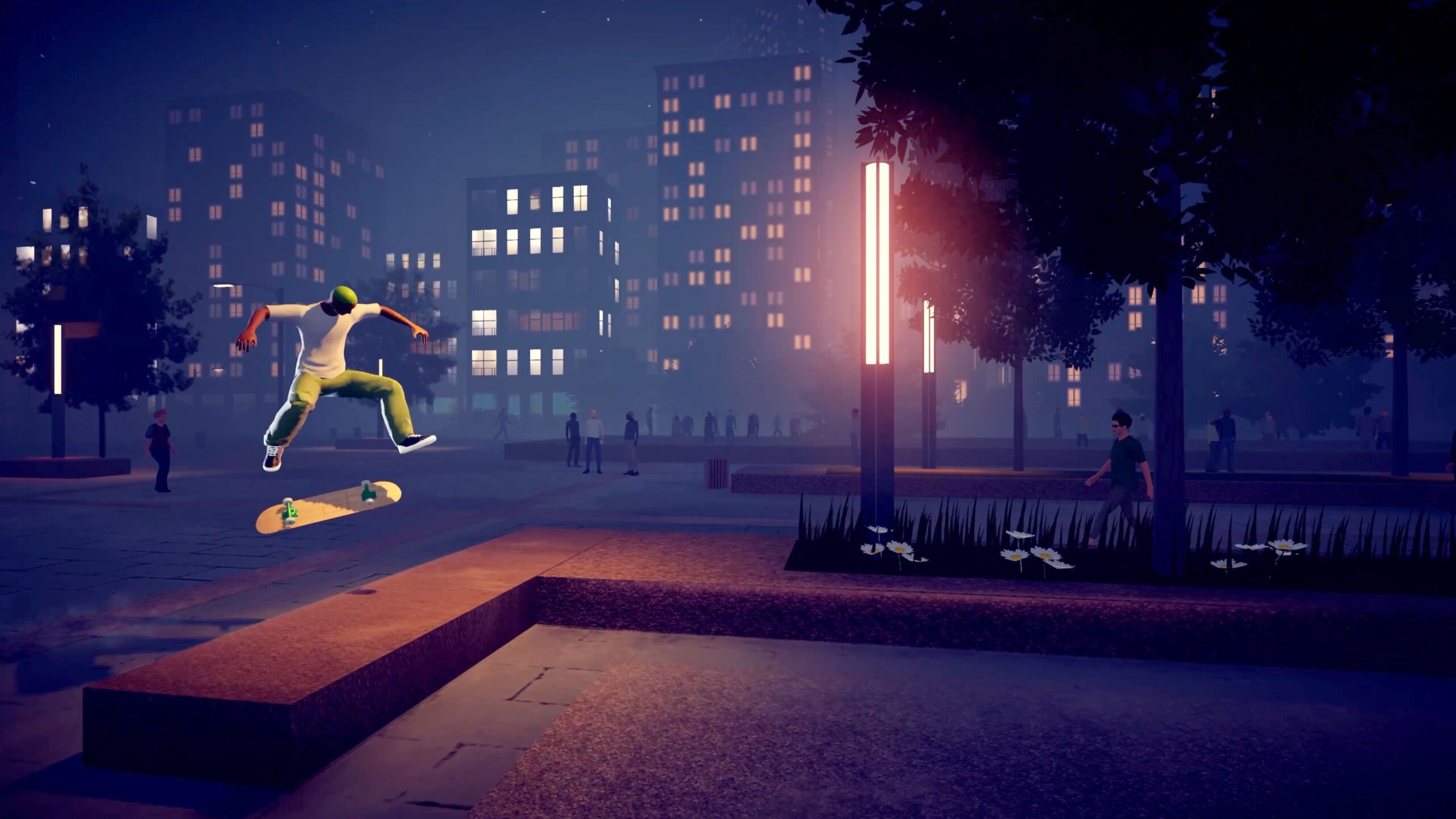 A skater mid-olly in a skate park at night.