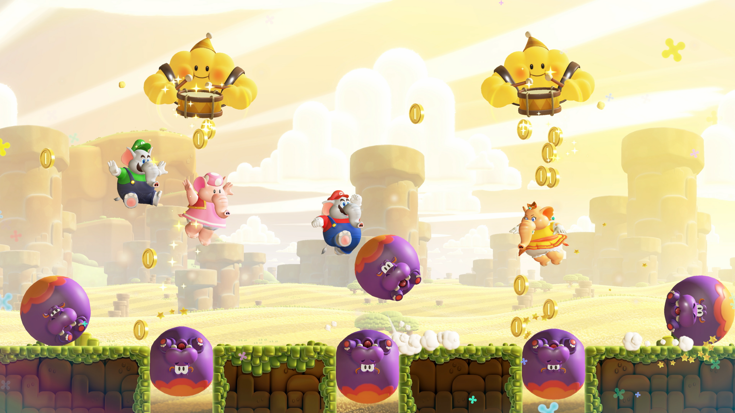 Mario characters dressed as elephants bounce on hippos.