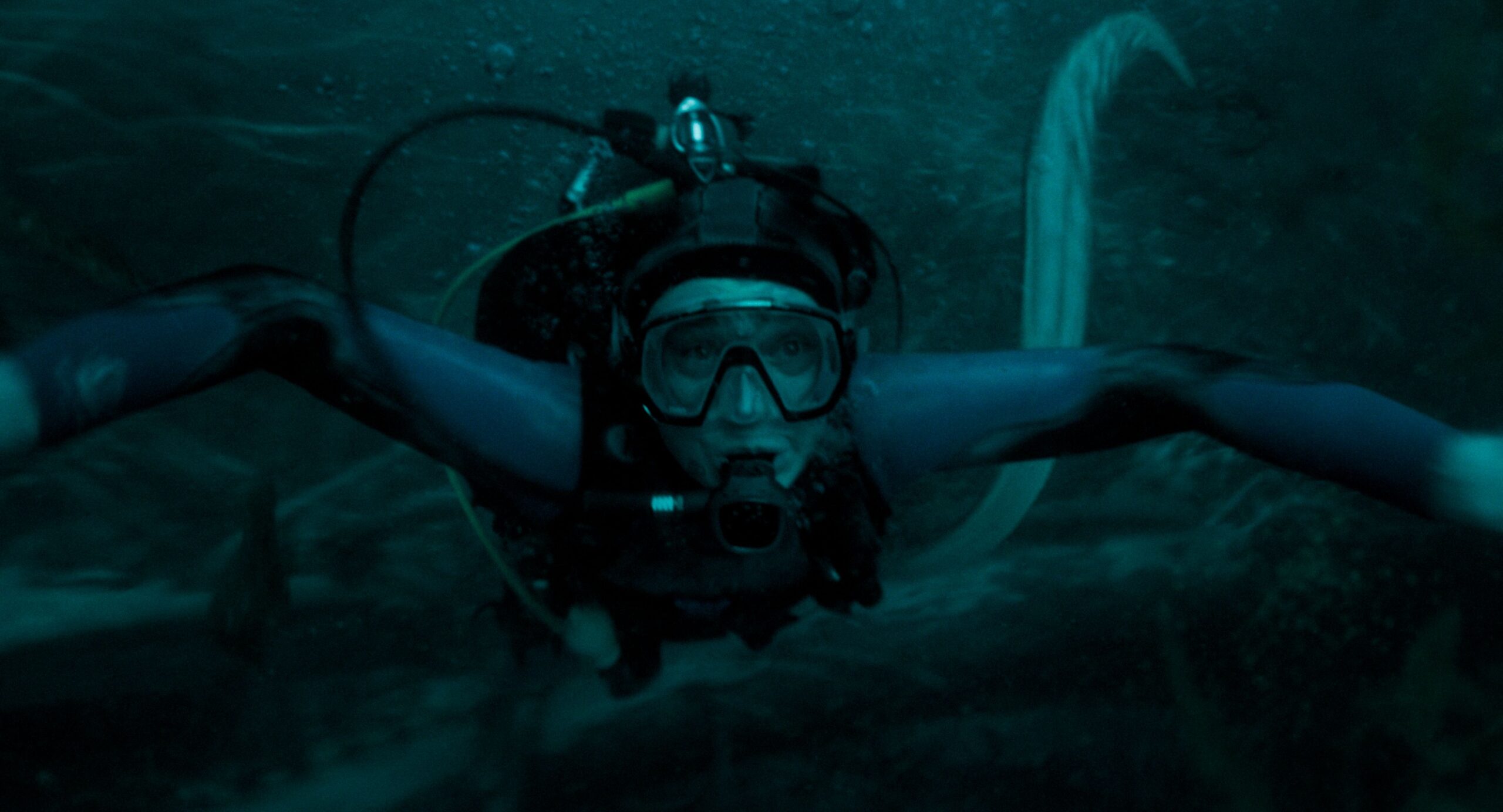 Image from Whalefall showing a diver desperately trying to swim away from the horrors of the ocean (he's unsuccessful).