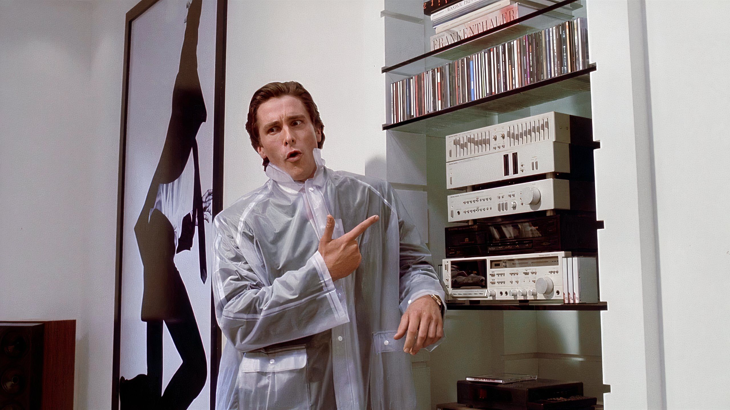 Patrick points at his music collection in American Psycho