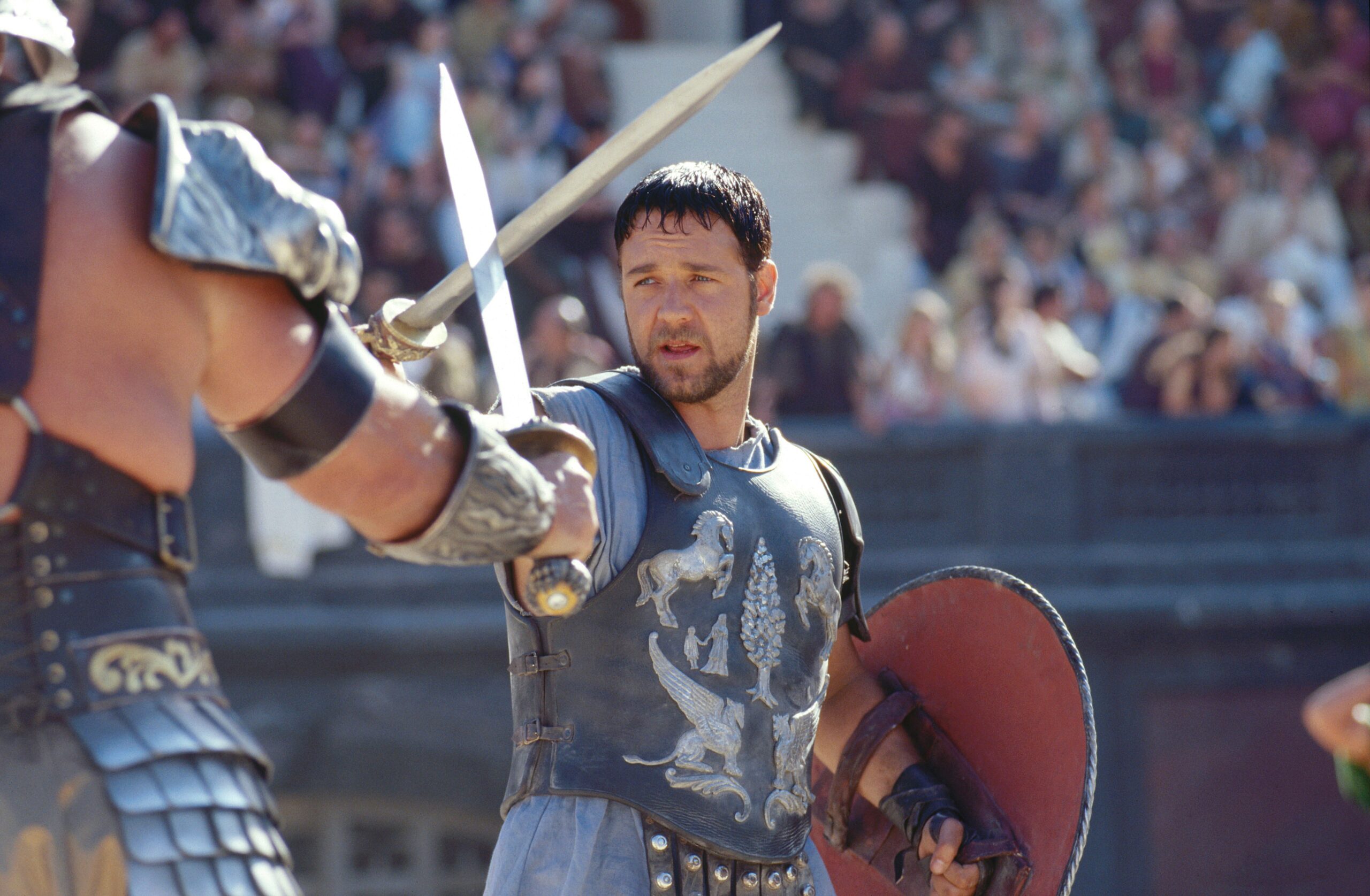 The gladiator Maximus (Russell Crowe) crosses swords with an opponent in the Colosseum in 2000’s Gladiator