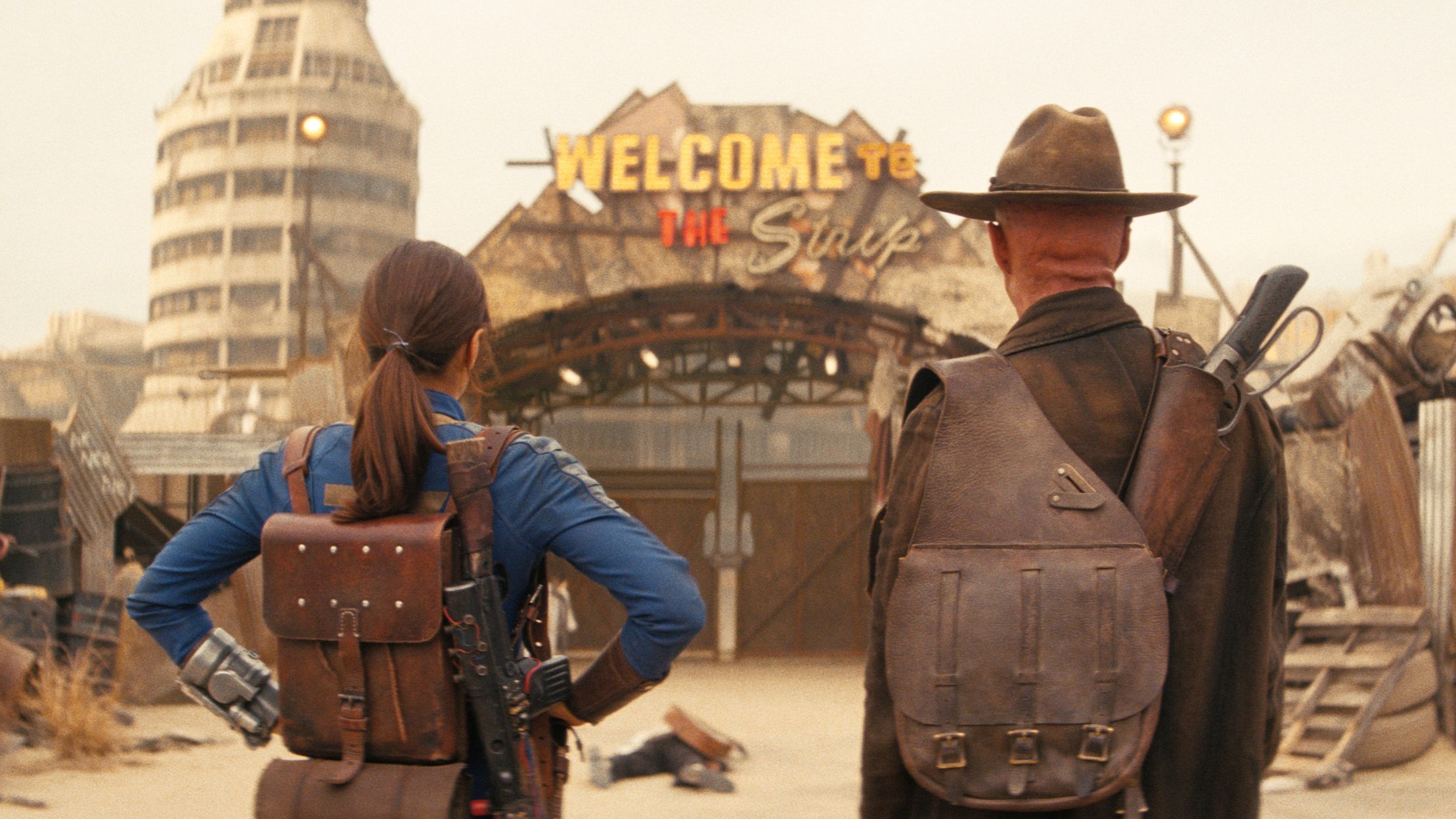 Lucy and The Ghoul stare at the New Vegas Strip gate in Fallout season 2
