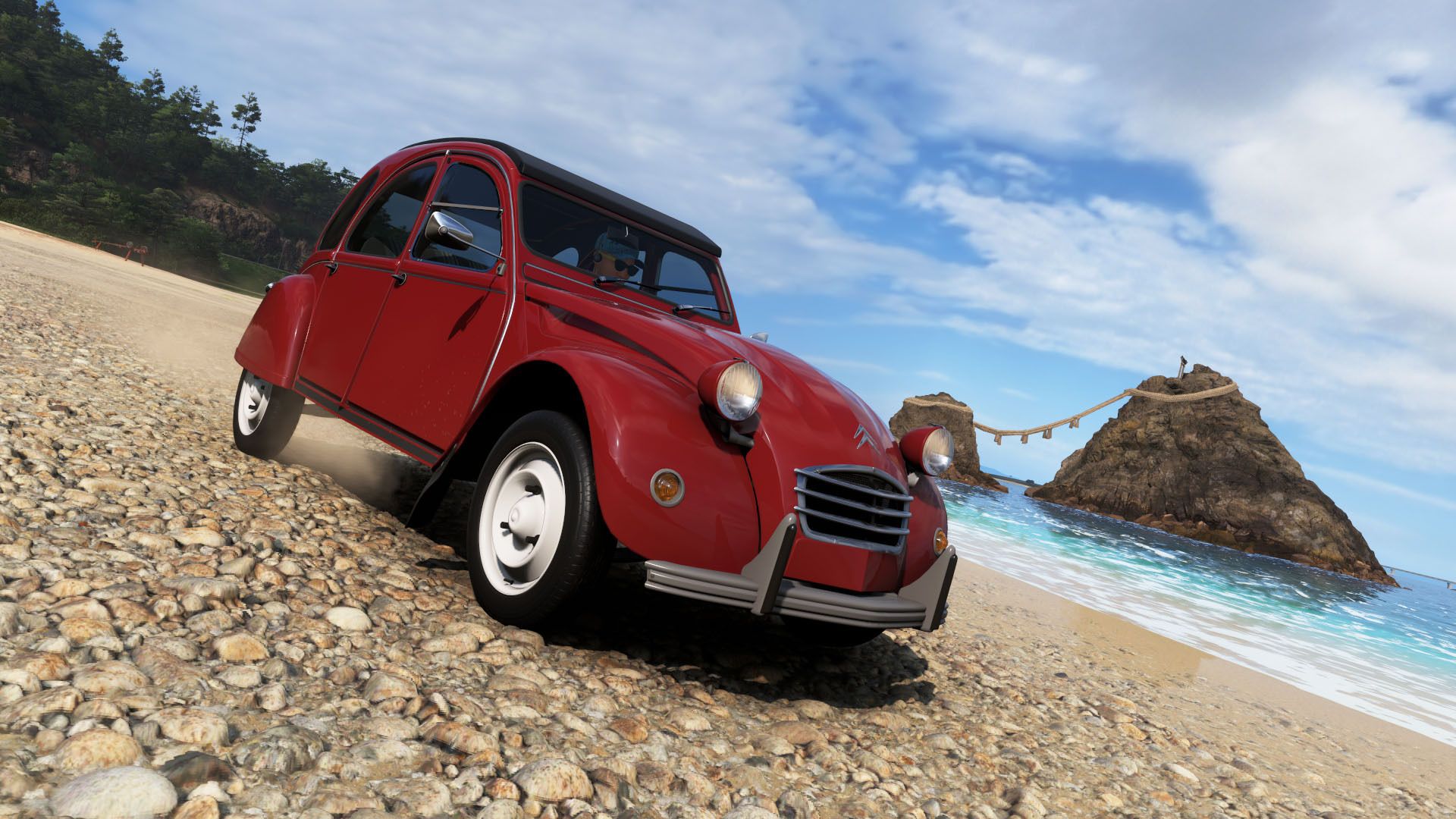 A red Citroen 2CV parked on a beach in Forza Horizon 6.