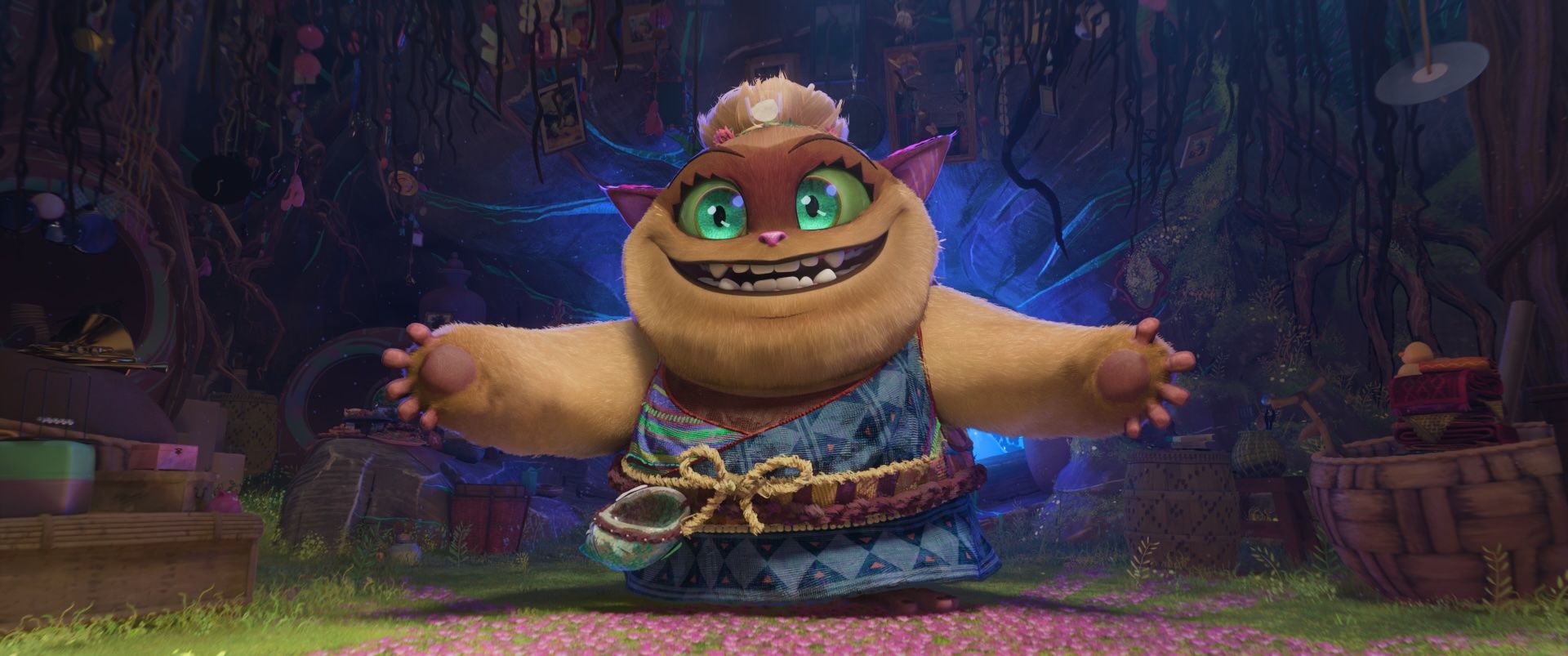 Batiba, a round catlike demon with huge green eyes, throws her arms open as if inviting a hug in the animated movie Forgotten Island