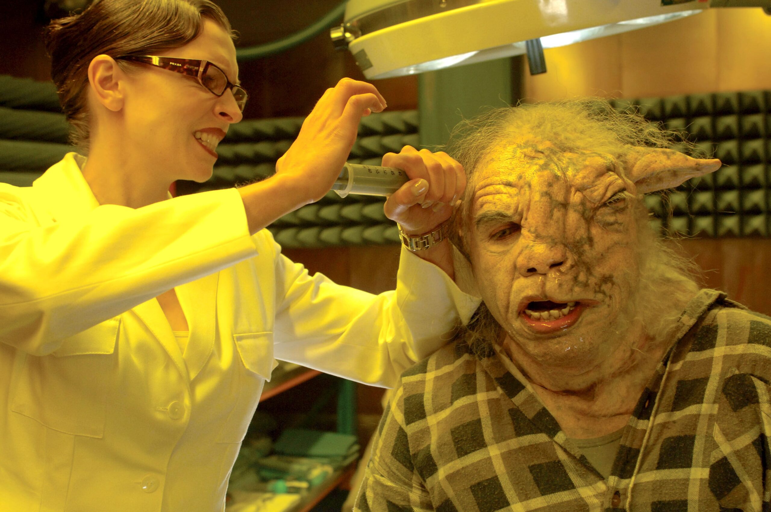 A scientist inserts a tool into the head of a were-sheep.