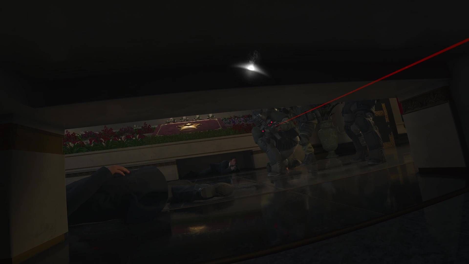 A Modern Warfare 4 screenshot showing the player hiding under a bench while guards look underneath.