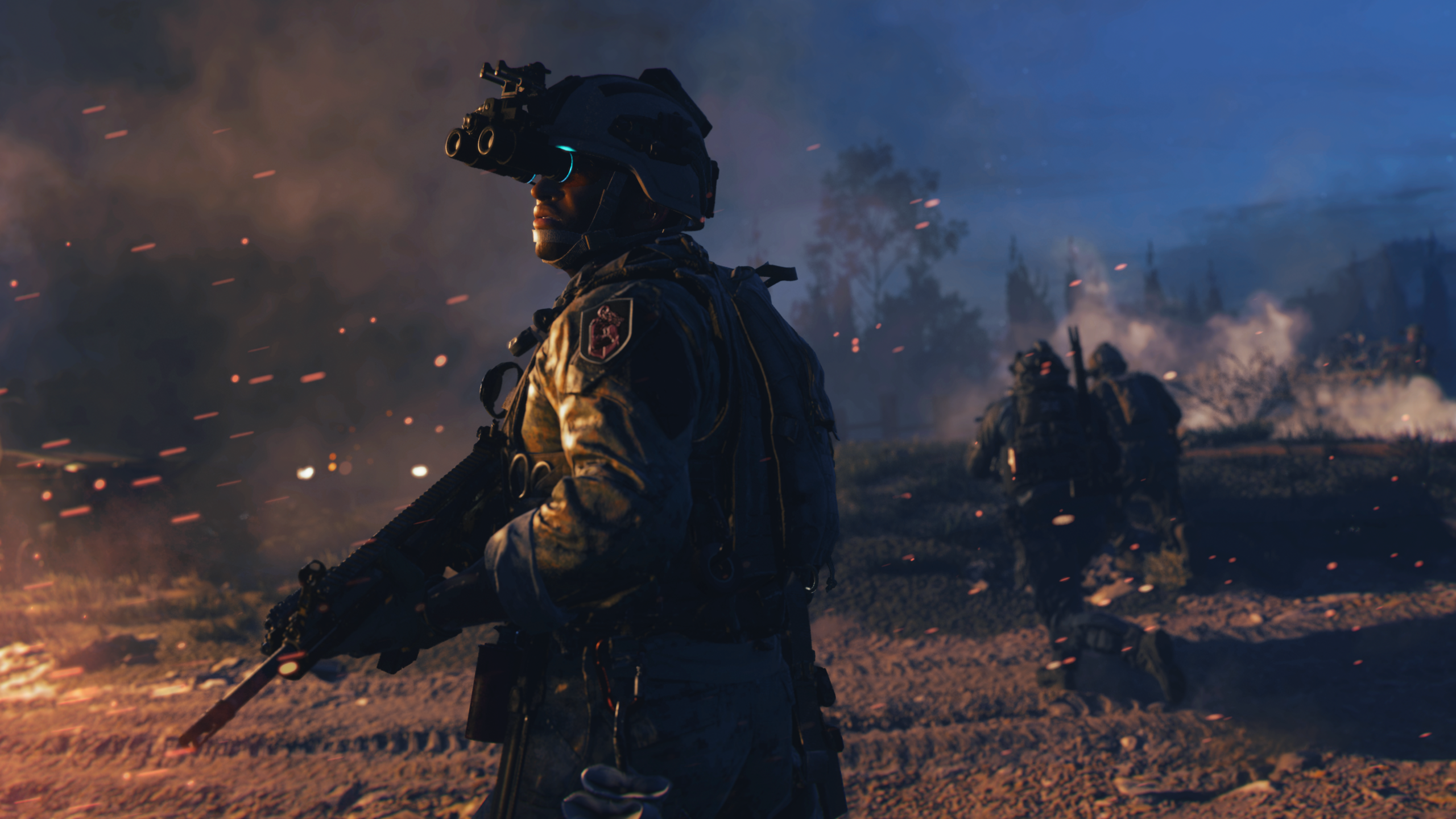 A soldier in Call of Duty: Modern Warfare 2 (2022) standing in front of a burning car