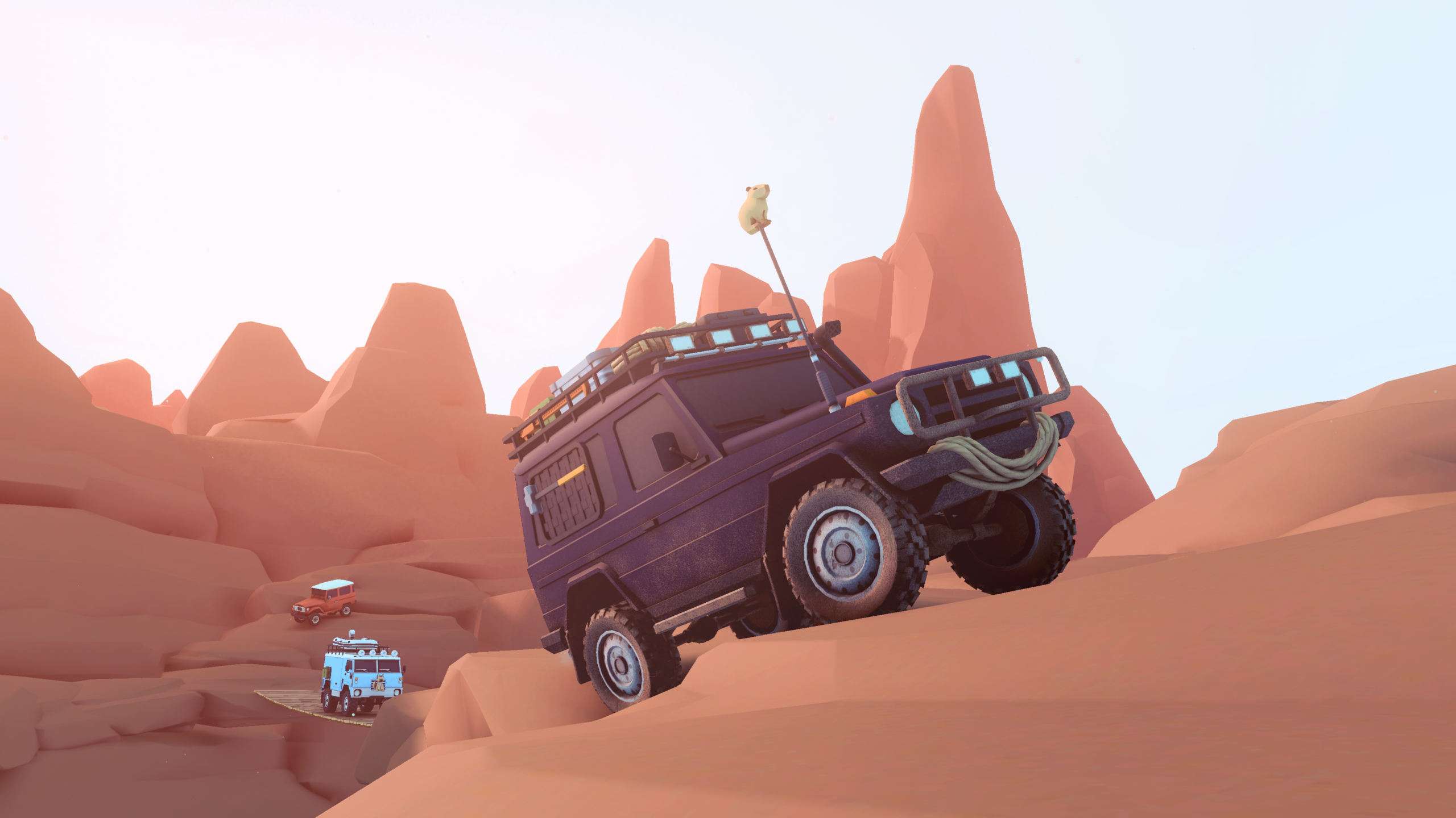 A 4x4 climbs a desert rock