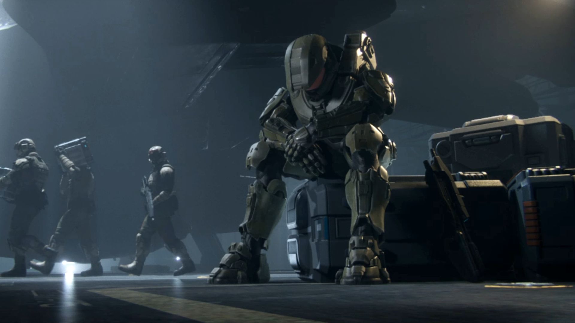Master Chief sitting alone, hanging his head.