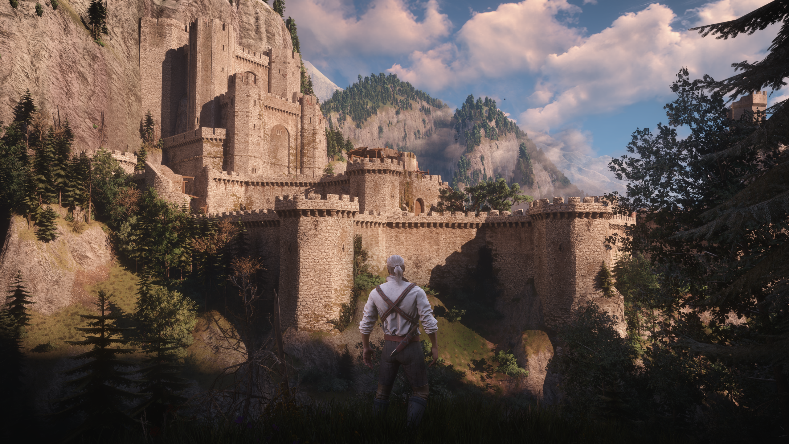 Geralt stands before the castle of Kaer Morhen